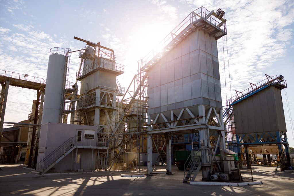 Factory with industrial facilities and buildings on sunny day